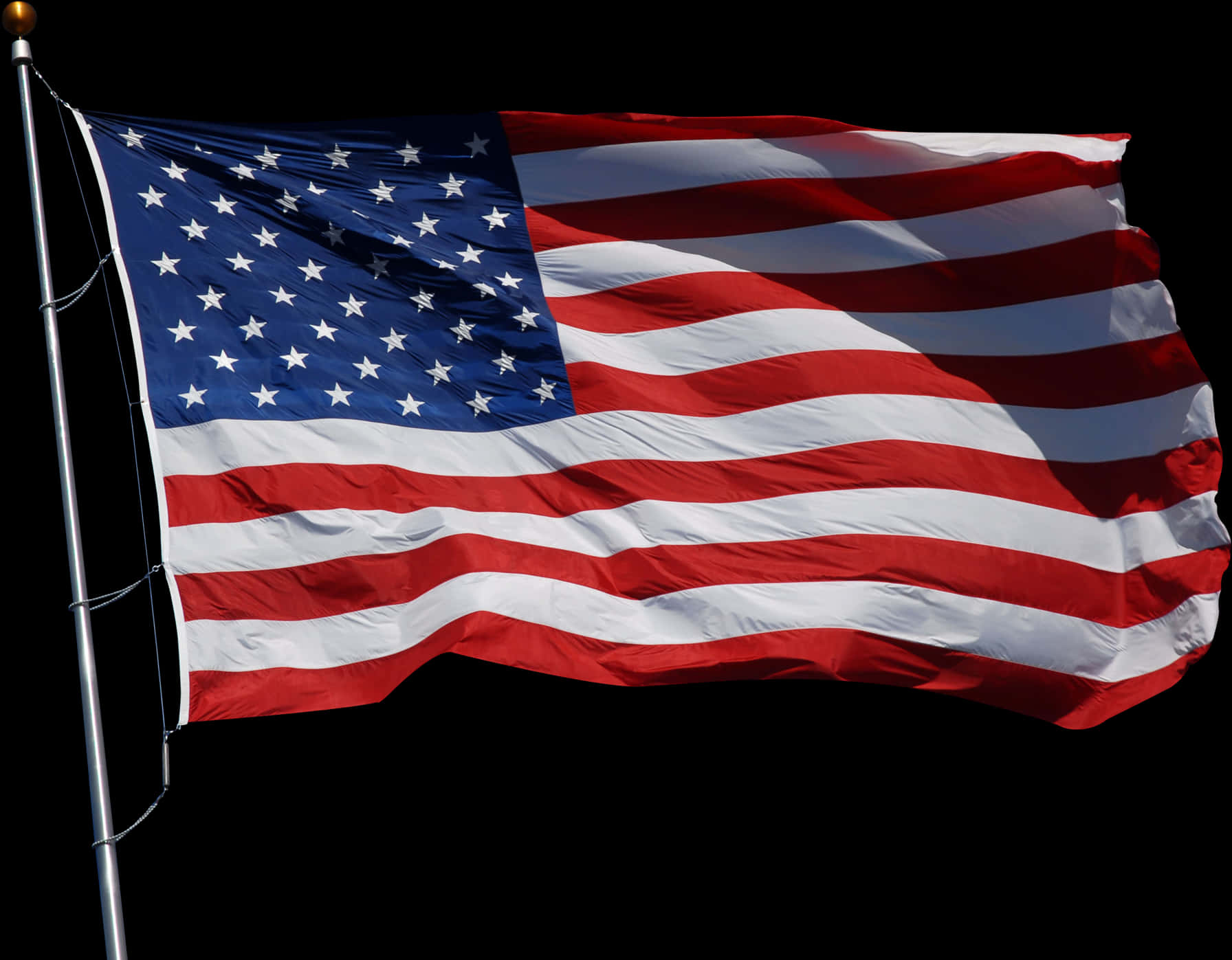 American Flag Waving Against Dark Background