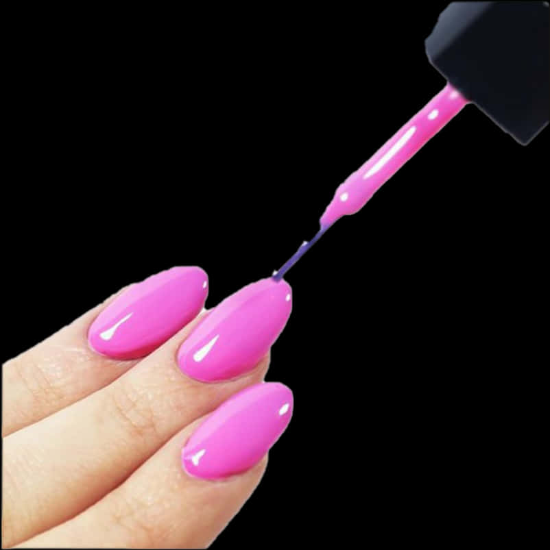 Applying Pink Nail Polish