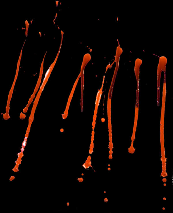 Blood Drops Falling Against Black Background