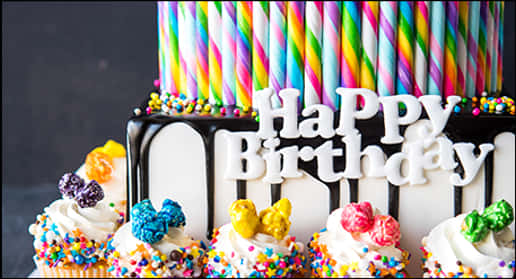 Colorful Birthday Cakewith Cupcakesand Candles PNG with transparent background