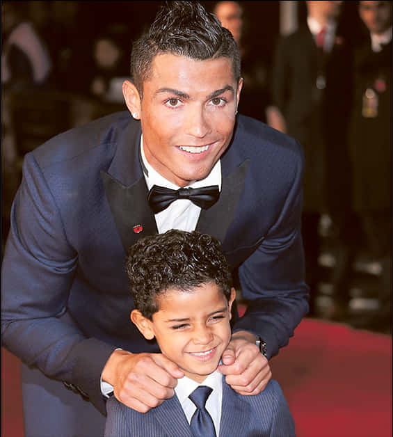 Cristiano Ronaldo Smiling With Child At Event PNG with transparent background