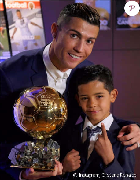 Cristiano Ronaldowith Golden Balland Child PNG with transparent background
