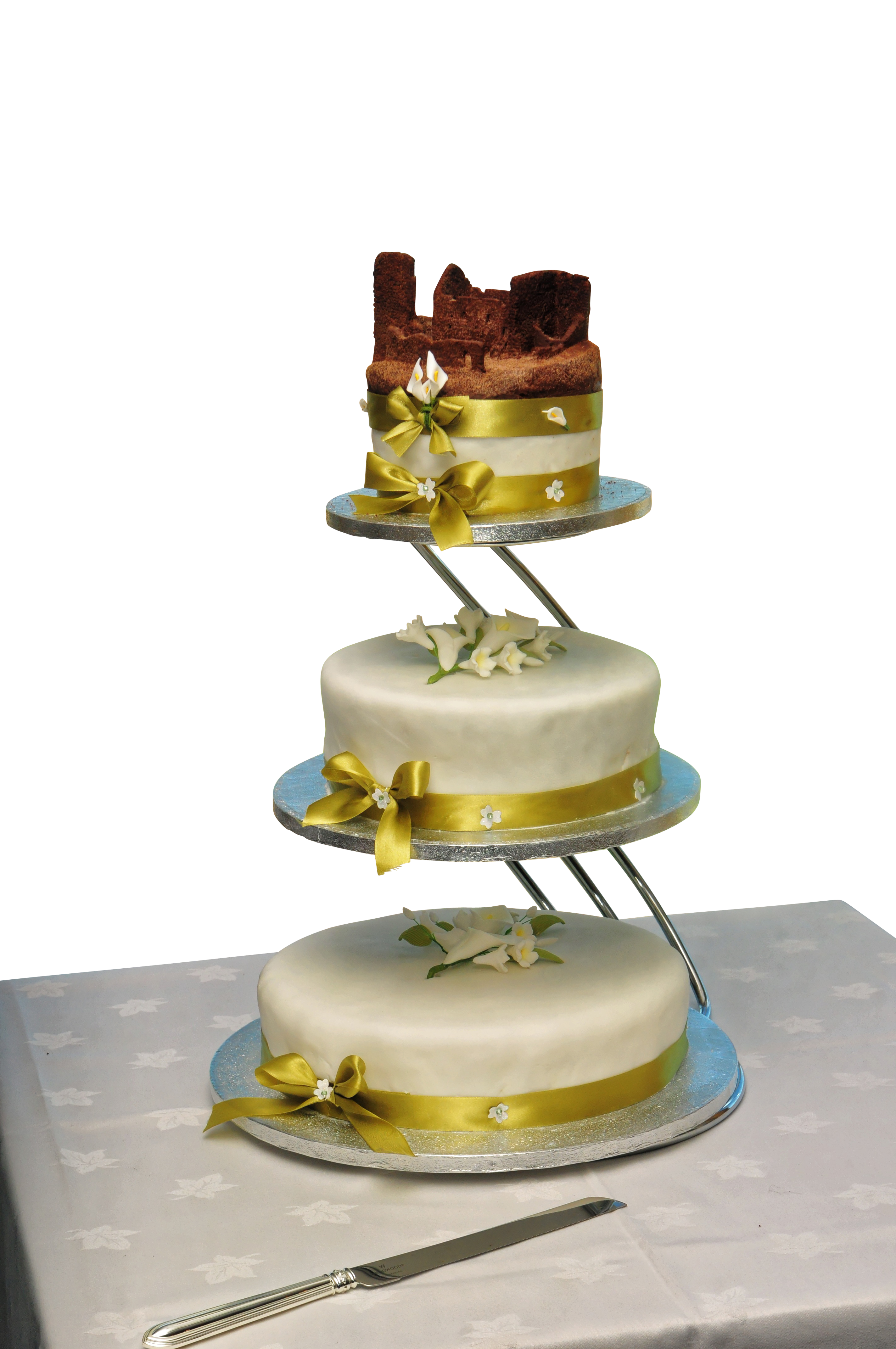 Elegant Three Tier Wedding Cakewith Gold Ribbons PNG with transparent background