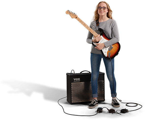 Female Guitarist With Amplifier