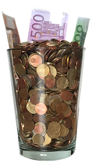 Glass Jar Fullof Coinsand Banknotes PNG with transparent background