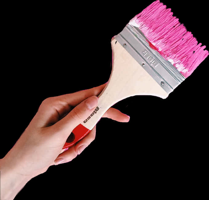 Hand Holding Pink Paint Brush