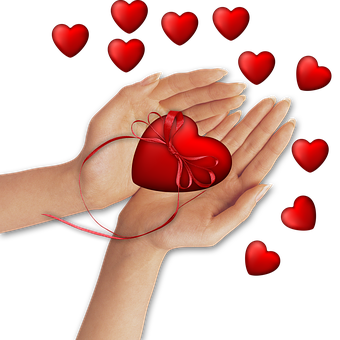 Hands Holding Red Heart Gift