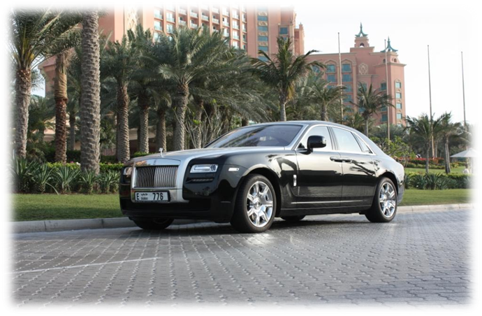 Rolls Royce Luxury Sedan Outside Hotel