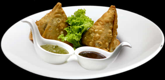 Samosaswith Chutneyson White Plate