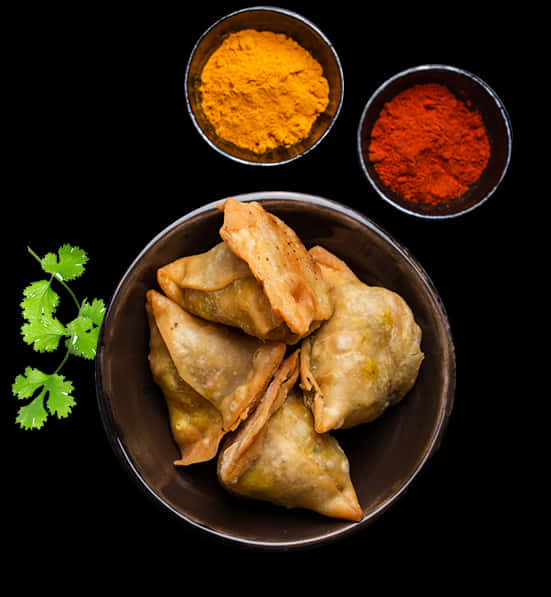 Samosaswith Spiceson Black Background