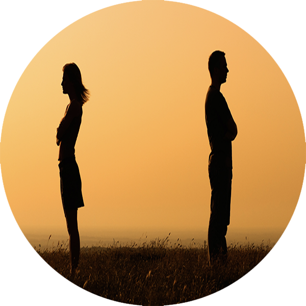 Silhouetted Couple Standing Apart During Sunset