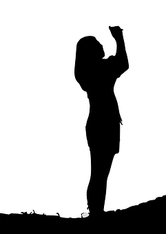 Silhouetteof Woman Raising Hand PNG with transparent background