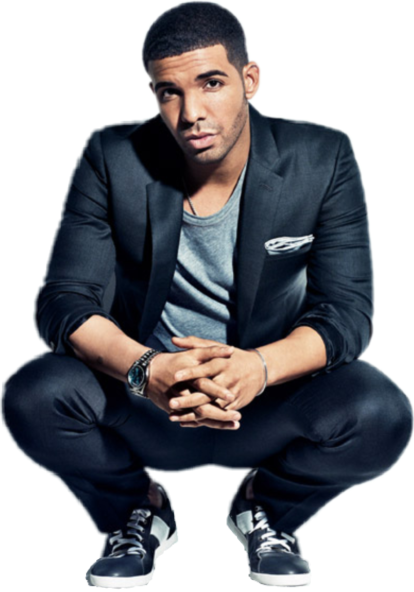 Stylish Man Seatedin Blazerand Sneakers PNG with transparent background