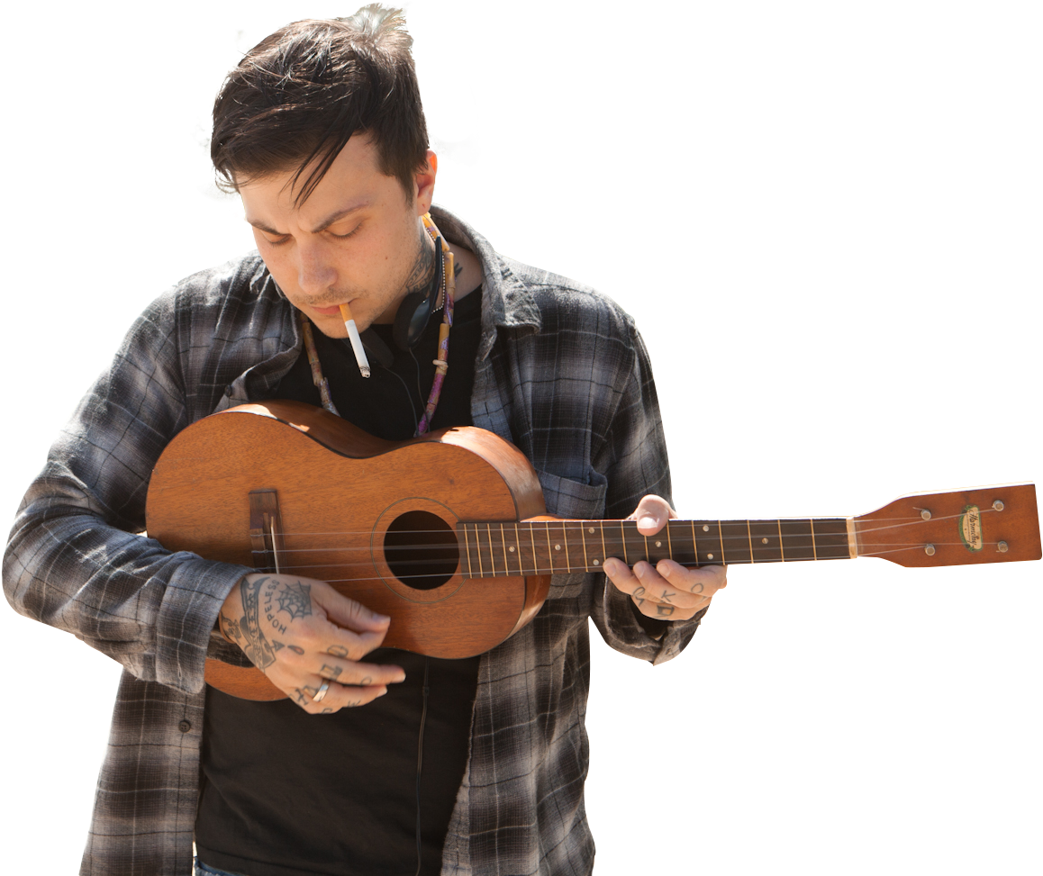 Tattooed Musician Playing Ukulele