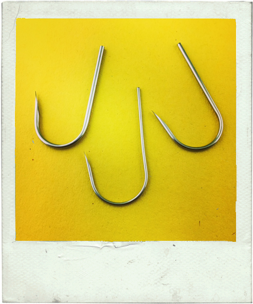 Three Fish Hooks Yellow Background