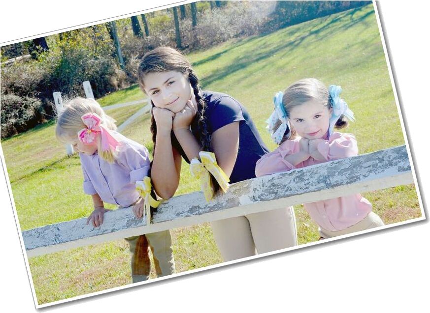 Three Girls Leaningon Fence Outdoors