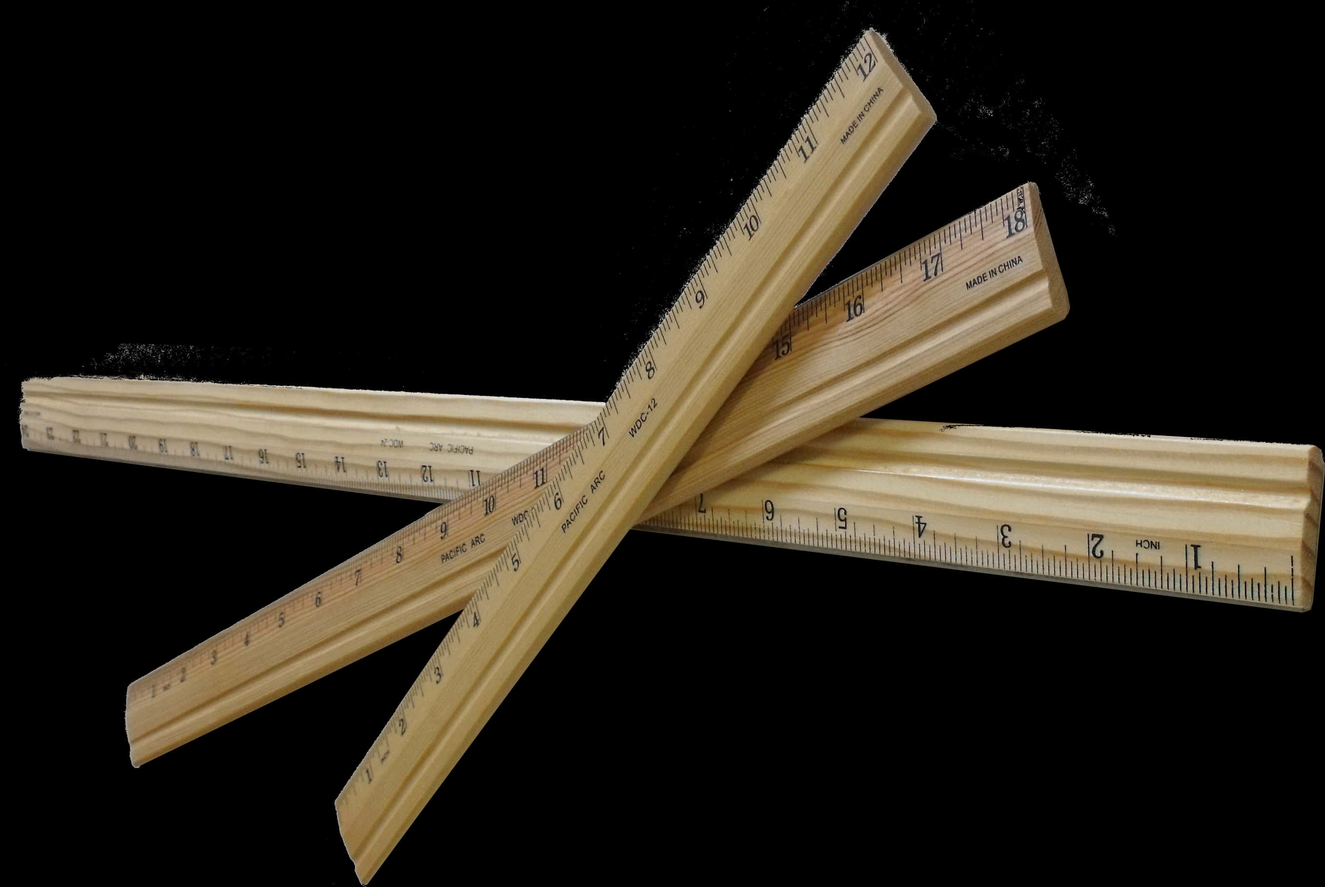 Wooden Rulers Crossedon Black Background