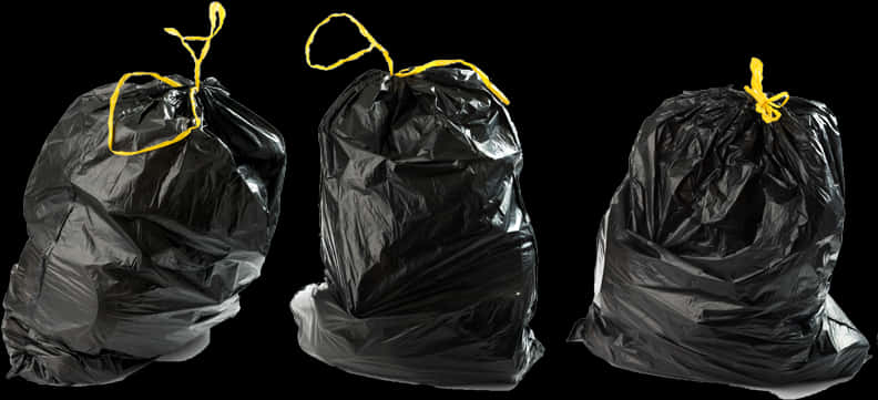 Black Garbage Bagswith Yellow Ties PNG Image