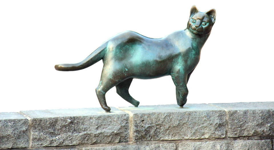 Bronze Cat Sculpture Stone Ledge PNG Image