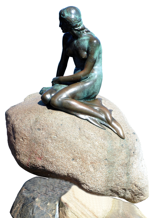 Bronze Mermaid Sculptureon Rock PNG Image