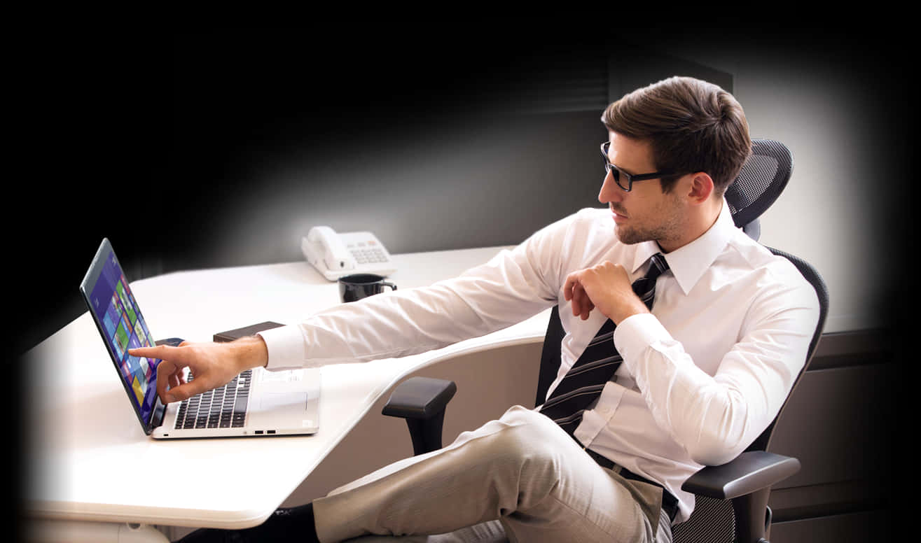 Businessman Using Laptop Office Setting PNG Image