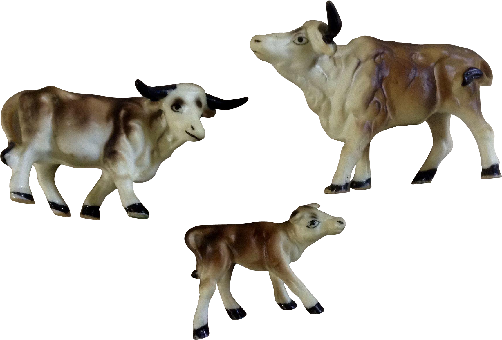 Ceramic Cowand Calves Figurines PNG Image