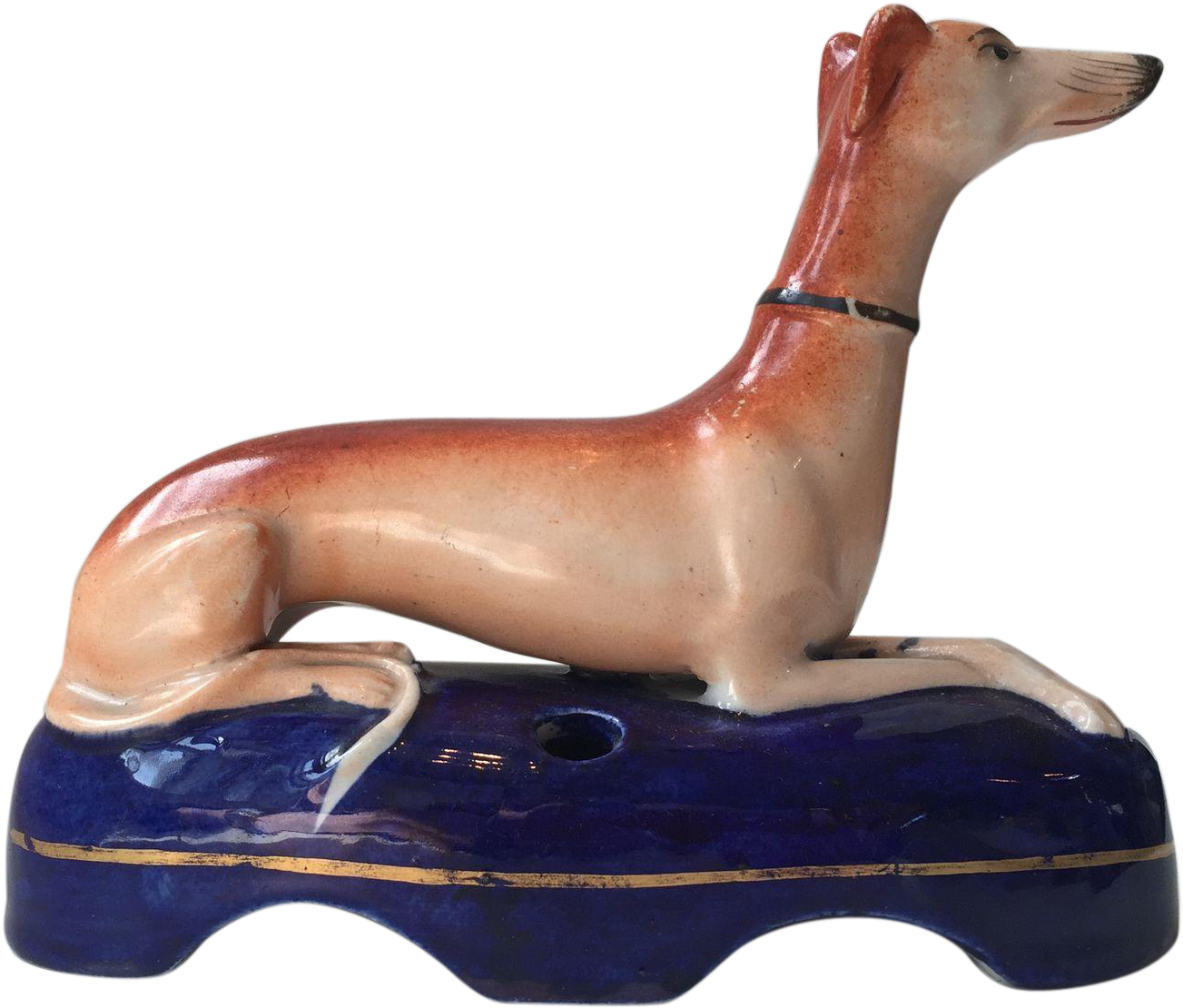 Ceramic Greyhound Figurineon Blue Base PNG Image