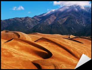 Desert_ Dunes_with_ Mountain_ Backdrop.jpg PNG Image