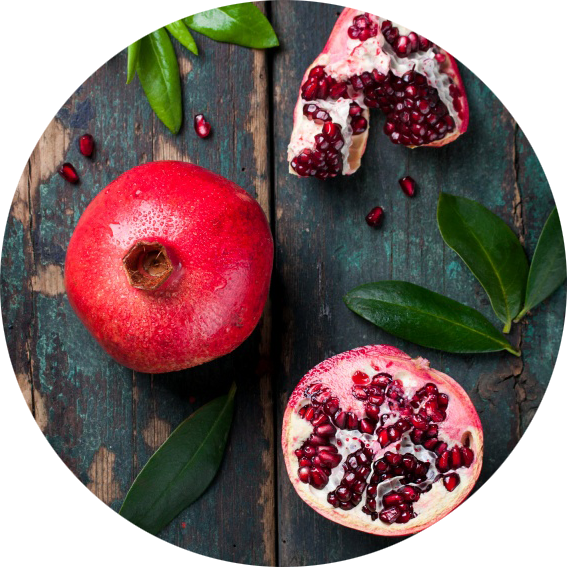 Fresh Pomegranateand Seedson Wooden Background PNG Image