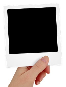 Hand Holding Blank Polaroid Frame PNG Image