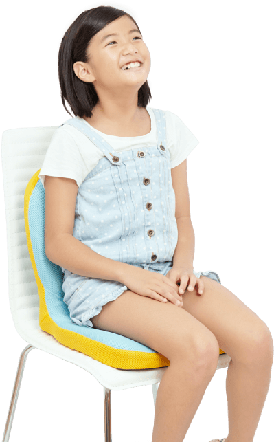 Happy Young Girl Sittingin Colorful Chair PNG Image