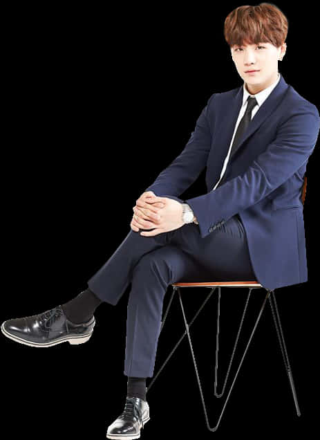 Manin Blue Suit Seated PNG Image