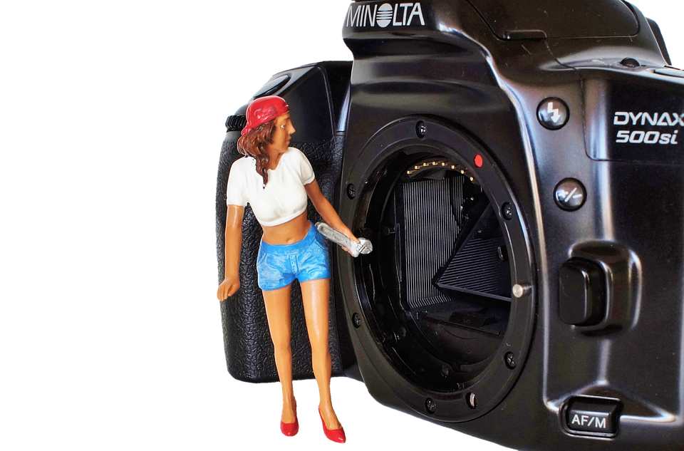 Miniature Figure Cleaning Camera Sensor PNG Image