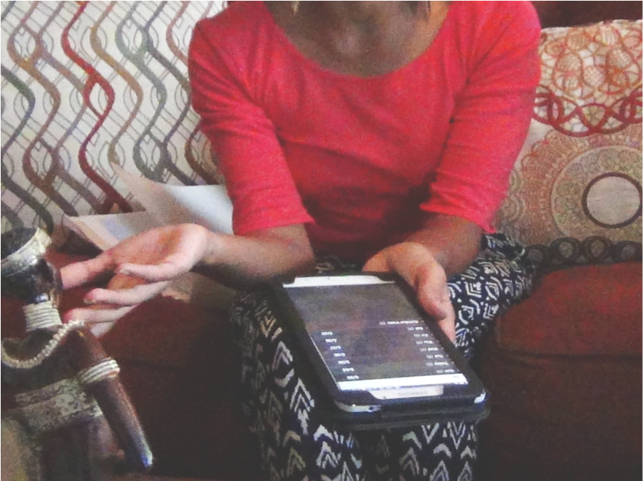 Person Using Tablet Indoors PNG Image