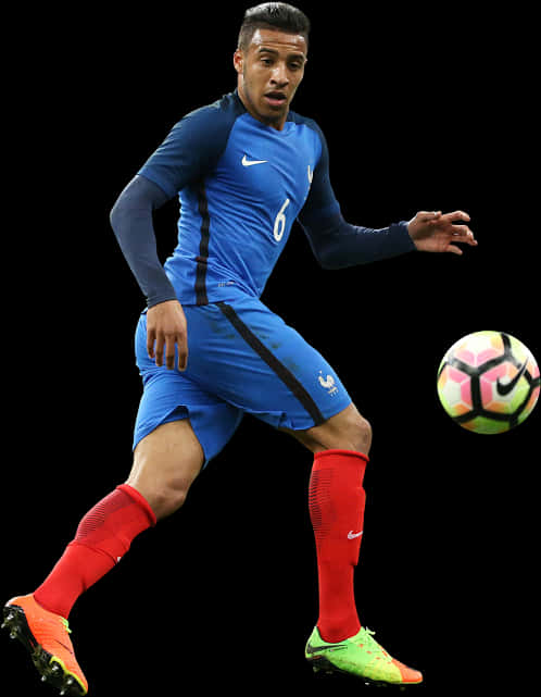 Soccer_ Player_in_ Blue_ Kit_ Action_ Shot PNG Image