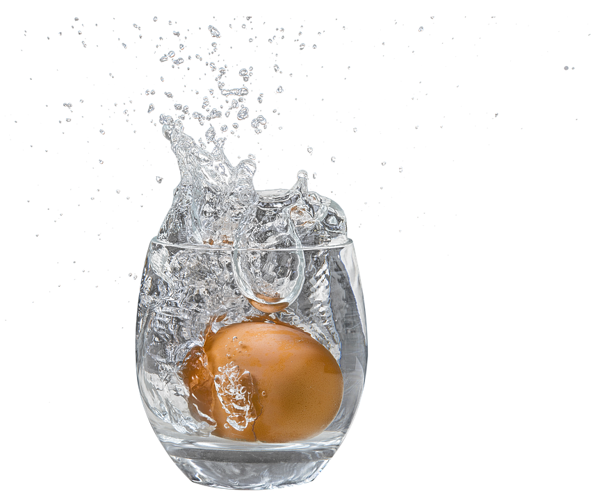 Splashy Egg Dropin Water Glass PNG Image