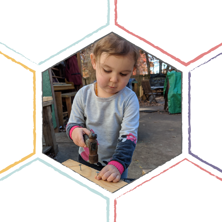 Toddler Using Hammer Outdoors PNG Image