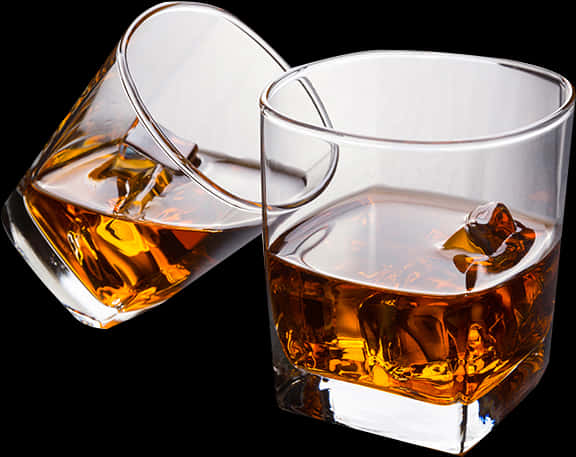 Whiskey Glasses Tilted With Ice PNG Image