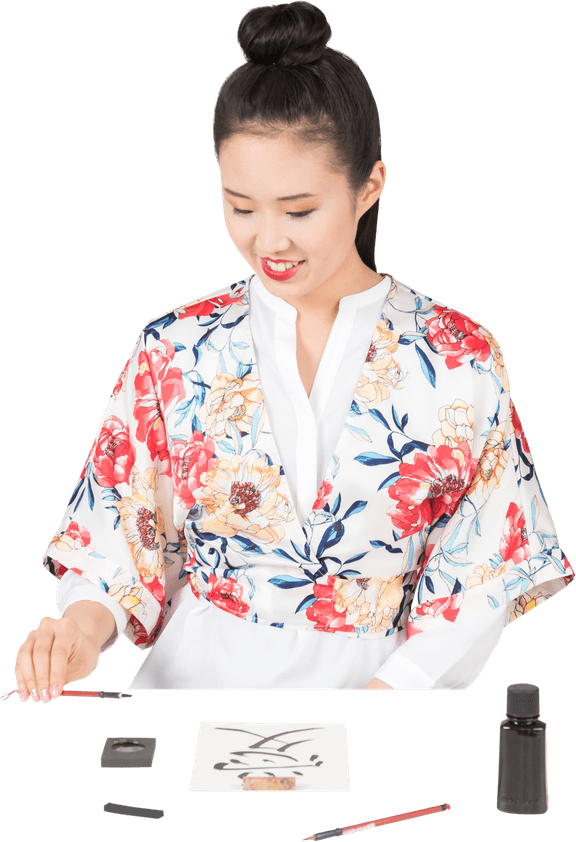 Womanin Floral Kimono Practicing Calligraphy PNG Image