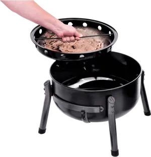 Adding Wood Chipsto Smoker PNG Image