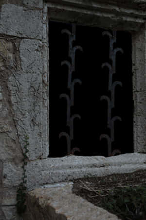 Ancient Stone Windowwith Iron Bars PNG image with transparent background