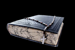 Antique Bookand Rosary Beadswith Cross PNG with transparent background
