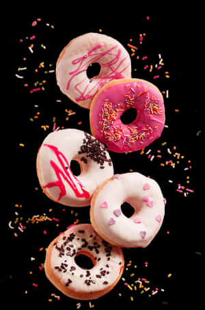 Assorted Donuts Fallingwith Sprinkles.jpg PNG image with transparent background