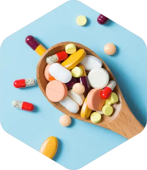 Assorted Medicationsin Wooden Spoon PNG Image