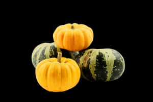 Assorted Mini Pumpkinson Black Background PNG image with transparent background