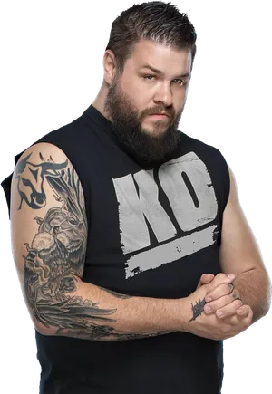 Bearded Manwith K O Shirtand Tattoos PNG Image