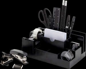 Black Stationery Collectionon Desk PNG image with transparent background