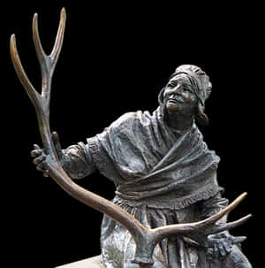 Bronze Statueof Indigenous Personwith Antlers PNG image with transparent background