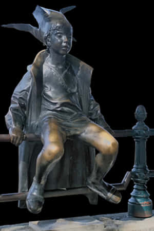 Bronze Statueof Seated Boywith Hat PNG image with transparent background