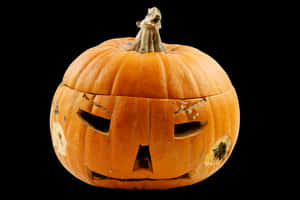 Carved Halloween Pumpkin Black Background PNG image with transparent background